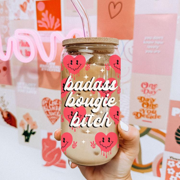 Badass bougie bitch glass cup 20oz with red retro smiley face hearts holding a peace sign up. Boss woman valentines day gift ideas. 20oz Vday glass cups with bamboo lid and glass straws.